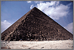 Pyramids with tiny humans for scale.