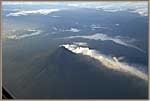 Early Morning Flight Over A Volcano