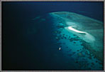 Aerial Of Sailboat At Great Barrier Reef