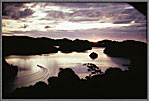 Small Boat In Lagoon At Sunset